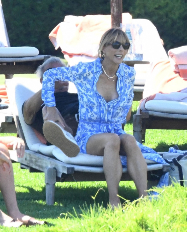 77-year old Sylvester Stallone and his wife Jennifer Flavin are seen taking in the hot sunshine during the excessive heat of the European heatwave as they chill with a few friends at the Cala di Volpe Hotel.