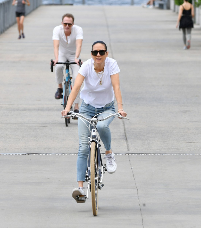 EXCLUSIVE: Jennifer Connelly and Paul Bettany Are Spotted on a Bike Ride in New York City.