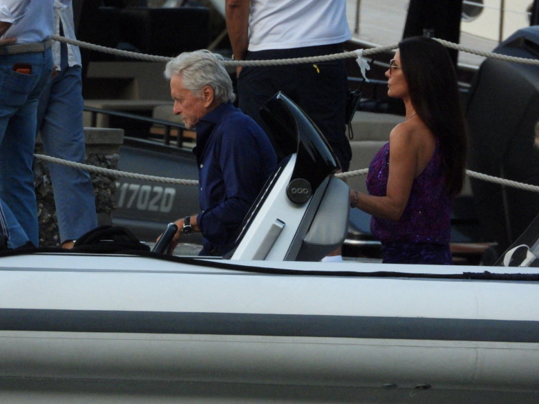 Michael Douglas and Catherine Zeta-Jones strolling hand in hand in Portofino