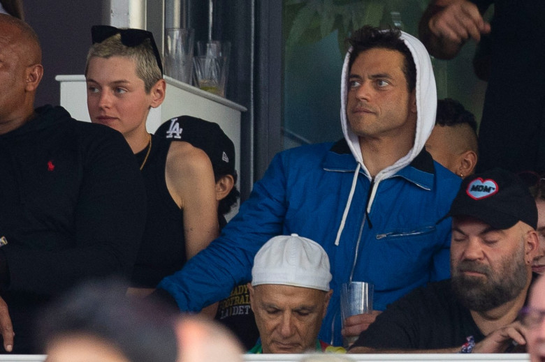 EXCLUSIVE: Rami Malek and Lucy Boynton have split after more than five years together- weeks after he was seen with The Crown’s Emma Corrin in these exclusive photos. Malek, 42, looked close with Corrin, 27, at "American Express Presents BST Hyde Park" fe