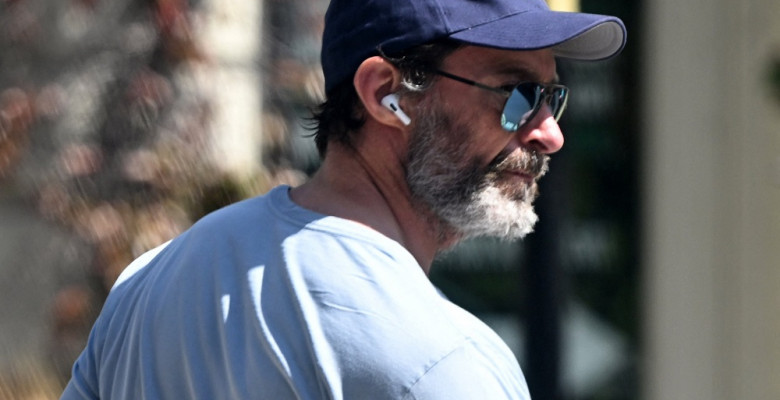EXCLUSIVE: Hugh Jackman is seen in Notting Hill taking a stroll in his new favourite cap, a Wrexham FC cap that was given to him by friend, actor and Co-Owner of the Football Club. Ryan Reynolds. Hugh, sporting his muscular physic, took a walk in the Lond
