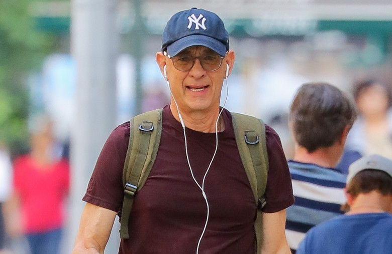 EXCLUSIVE: Yankees Fan Tom Hanks Is Spotted On A Phone Call While Walking Around In New York