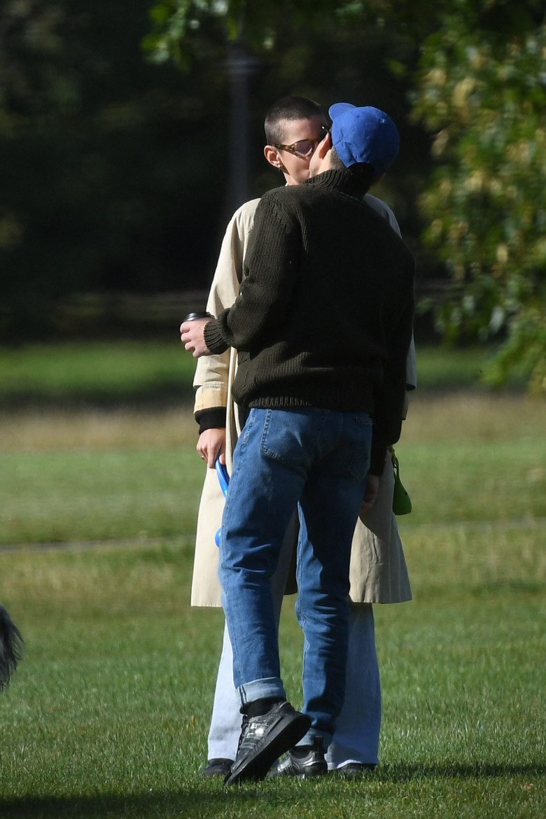 PREMIUM EXCLUSIVE: Rami Malek and Emma Corrin tenderly kiss while dog walking in a London park - publicly confirming their relationship for the first time