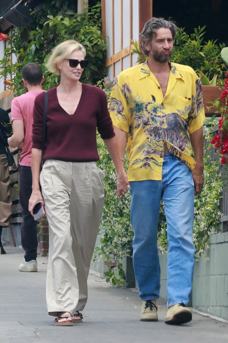 *PREMIUM-EXCLUSIVE* Love is in the air! Charlize Theron and  Alex Dimitrijevic hold hands after a date! *** Web Embargo  until 11 pm ET on  May 16, 2023 ***