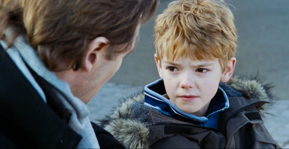 UK. Liam Neeson and Thomas Brodie-Sangster in a scene from the ©Universal Pictures movie : Love Actually (2003). Plot: Follows the lives of eight very different couples in dealing with their love lives in various loosely interrelated tales all set during