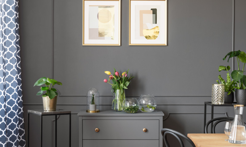 Flowers,On,Grey,Cabinet,Under,Posters,In,Minimal,Loft,Interior