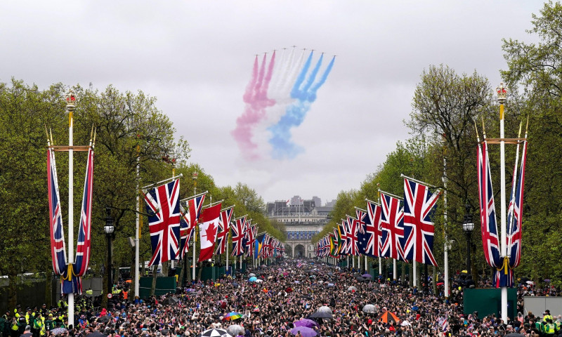 A general view of flypast by aircraft from the Red Arrows over the Mall following the coronation of King Charles III and Queen Camilla in London. Picture date: Saturday May 6, 2023.