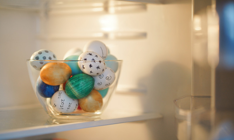 Colorful,Easter,Eggs,In,Transparent,Glass,Bowl,In,The,Fridge.
