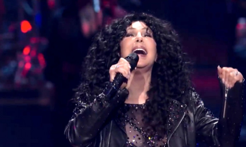 Cher looks stunning as she rocks the Saturday Night Live 50th Anniversary Concert in a skintight bedazzled bodysuit and leather jacket