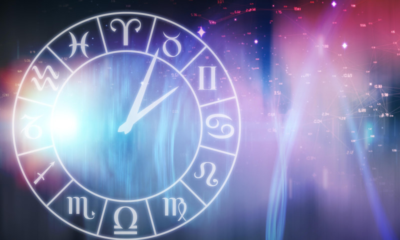 Vector image of clock with various Zodiac signs against illustration of illuminated light