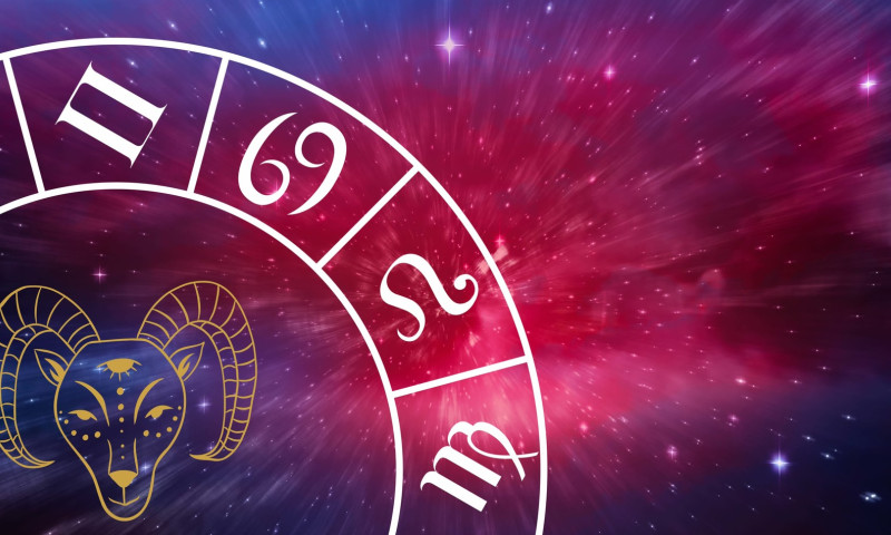 Composition of zodiac wheel with aries star sign over stars