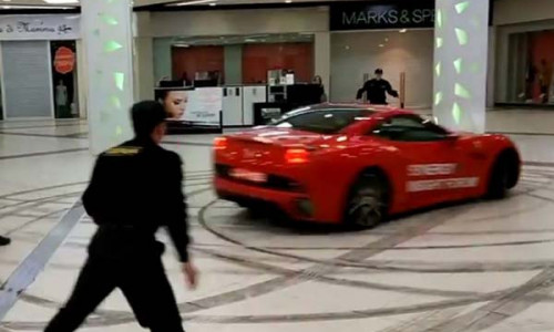 11-1491895814-russian-mayor-drives-ferrari-california-recklessly-at-moscow-mall1