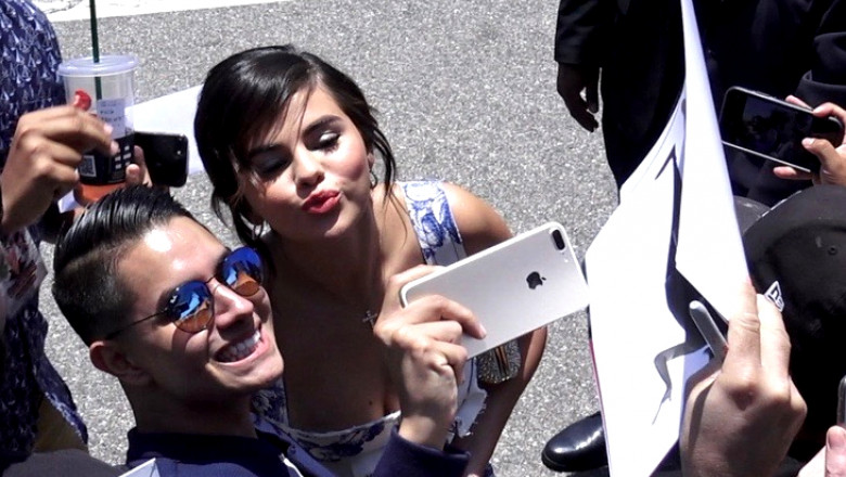 Selena Gomez Takes A Selfie With A Fan At The World Premiere Of Hotel Transylvania 3 Summer Vacation In Los Angeles