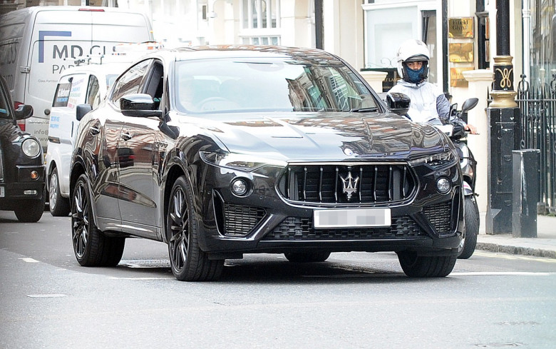 Romeo Beckham out in London driving his new Maserati Levante.