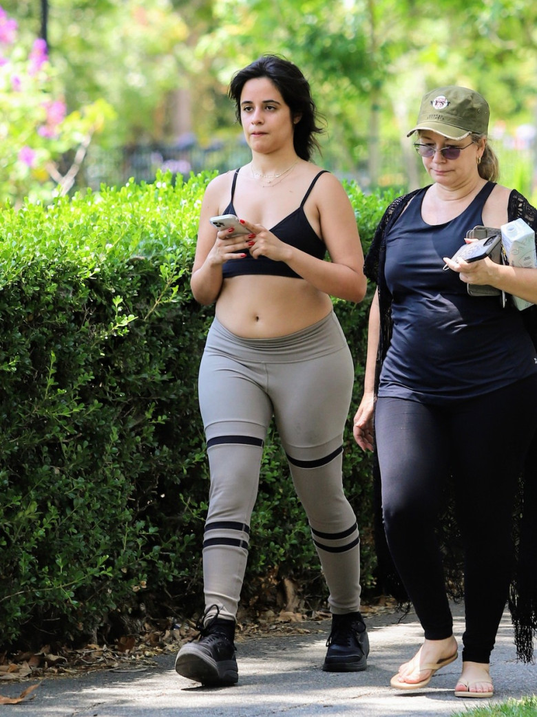 Camila Cabello seen getting excessive with her mother at the park in leggings and crop top
