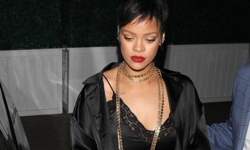 *EXCLUSIVE* Rihanna puts on a sultry display in black silk while leaving Delilah nightclub with friends!