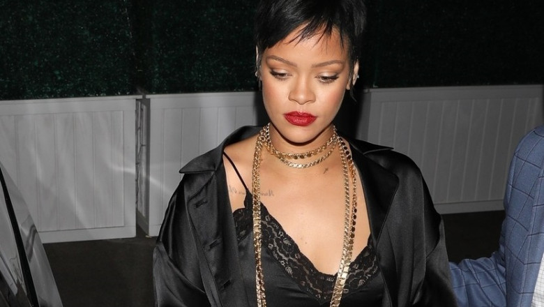 *EXCLUSIVE* Rihanna puts on a sultry display in black silk while leaving Delilah nightclub with friends!