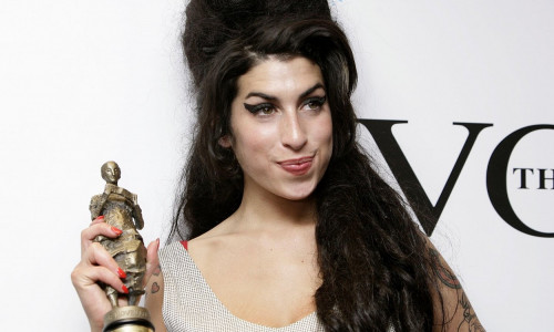 File photo dated 24/05/07 of Amy Winehouse after winning the Best Contemporary song award for her song 'Rehab' at the Ivor Novello Awards, at the Grosvenor House Hotel in cental London. Fans will mark 1 years since her death on Friday. Issue date: Friday