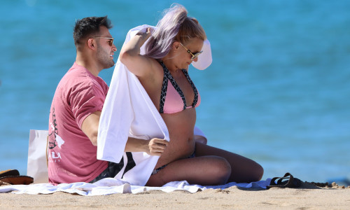 PREMIUM EXCLUSIVE: Britney Spears is seen wearing a pink and black bikini before covering up in a bath robe while on vacation with her boyfriend Sam Asghari