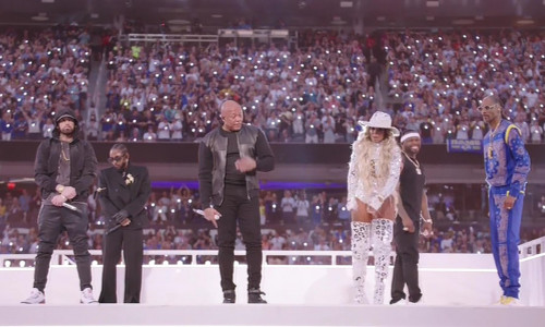 Eminem kneels during his performance while 50 Cent joins hip hop stars Dr Dre, Snoop Dogg, Mary J Blige, and Kendrick Lamar in surprise appearance at the Super Bowl LVI Half Time Show