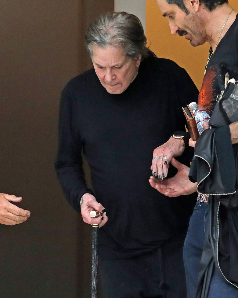 *EXCLUSIVE* Ozzy Osbourne gets some help down the stairs as he exits Milk Studios in LA