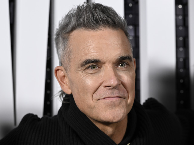 Robbie Williams recunoaște că este astăzi „în viață” pentru că a vorbit despre situația lui și a cerut ajutor