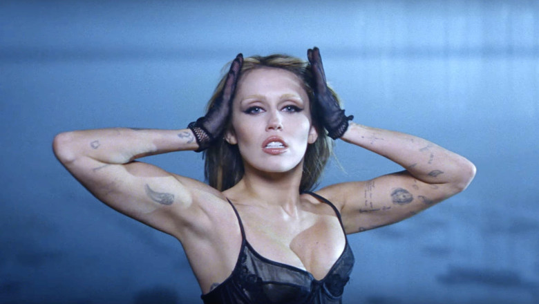 Miley Cyrus and Naomi Campbell steam up the screen as they strip off and strike a pose in Every Girl You've Ever Loved music video