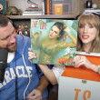 Taylor Swift gets a mouthful of confetti while announcing her upcoming “The Life of a Showgirl” album during an appearance on boyfriend Travis Kelce’s “New Heights” podcast