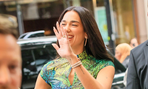 Dua Lipa turns heads in butterfly dress and knee-high boots at Selfridges pop-up launch