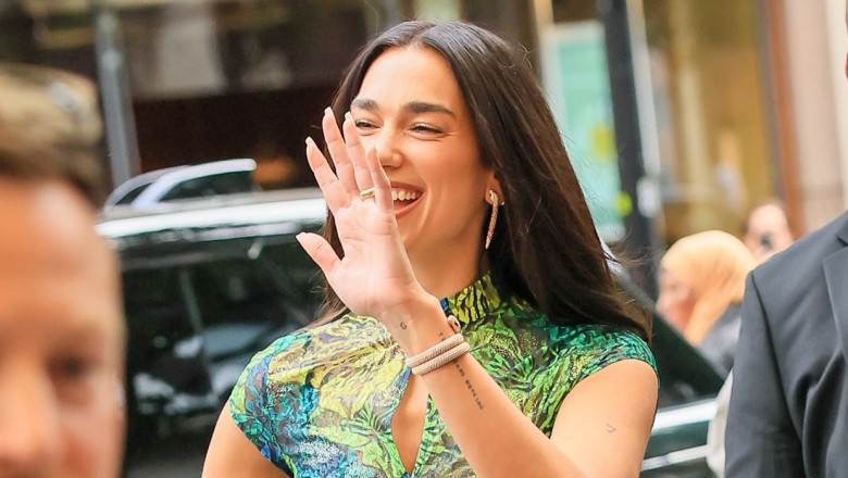 Dua Lipa turns heads in butterfly dress and knee-high boots at Selfridges pop-up launch