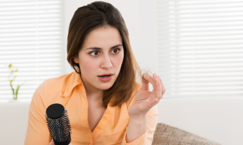 Woman Holding Loss Hair