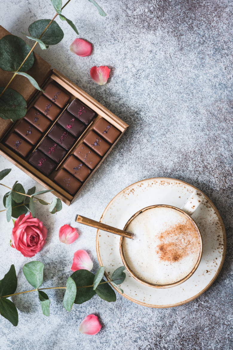 Chocolate candies, coffee and roses