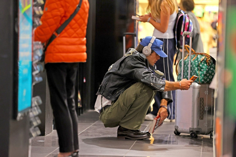 *EXCLUSIVE* Jacob Elordi wears a ‘James Dean Death Cult’ Cap and Leather jacket as he browses the book store at Sydney Airport