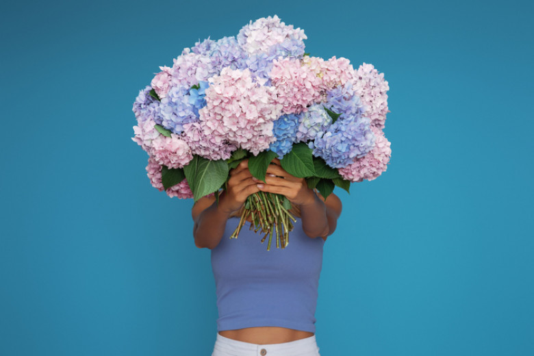 Woman holding a bouquet of flowers