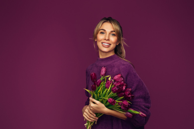 Beautiful woman with a bouquet of flowers