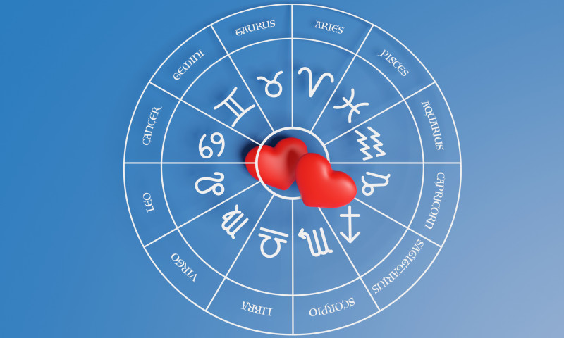 A pair of red hearts in the center of Zodiac circle on blue background. Illustration of the concept of love and relationship horoscope