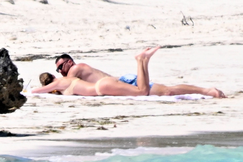 *PREMIUM-EXCLUSIVE* Taylor Swift and Travis Kelce are seen enjoying a very PDA filled day on the beach after a whirlwind year!