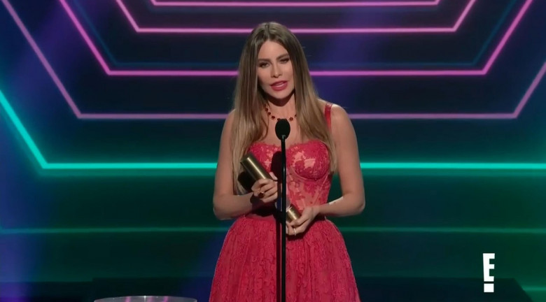 Sofia Vergara stuffs her mask in her cleavage before getting emotional at winning ' last ever award' for her Modern Family role at the People's Choice Awards