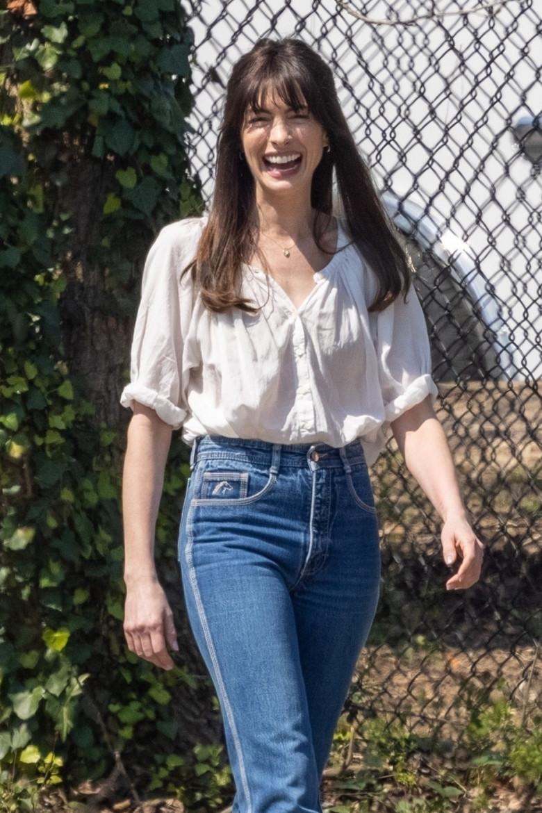 *EXCLUSIVE* Anne Hathaway caught on casual stroll during "Flowervale Street" filming