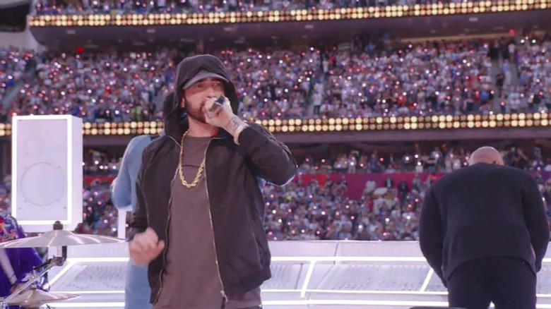 Eminem kneels during his performance while 50 Cent joins hip hop stars Dr Dre, Snoop Dogg, Mary J Blige, and Kendrick Lamar in surprise appearance at the Super Bowl LVI Half Time Show