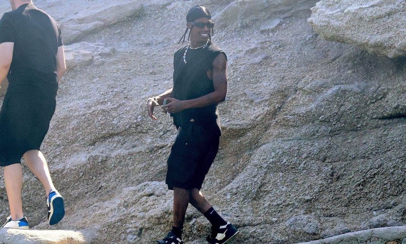 *EXCLUSIVE* The American Rapper and Record Producer Travis Scott is spotted exploring around the rocky Spilia Beach during his Greek vacation on Mykonos Island.