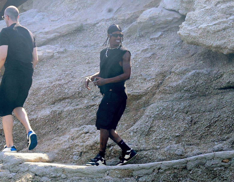 *EXCLUSIVE* The American Rapper and Record Producer Travis Scott is spotted exploring around the rocky Spilia Beach during his Greek vacation on Mykonos Island.