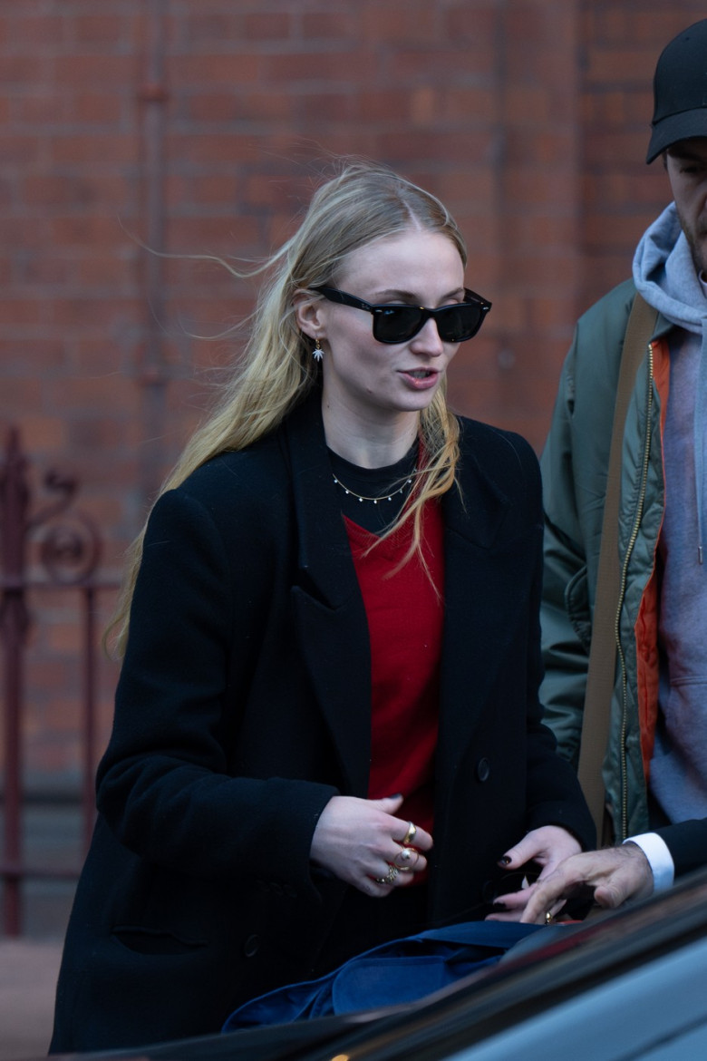 EXCLUSIVE: Sophie Turner Gives Her Feet A Post Fashion Week Rest As She Travels Back To London In A Pair Of Ugg Shoes - 06 Mar 2024