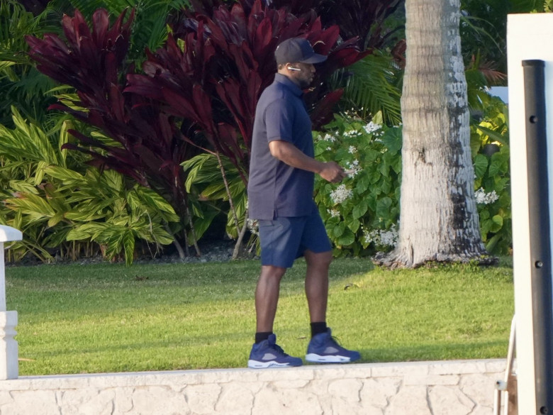 Sean â€�Diddyâ€™ Combs looks tense as he takes a phone call on Star Island