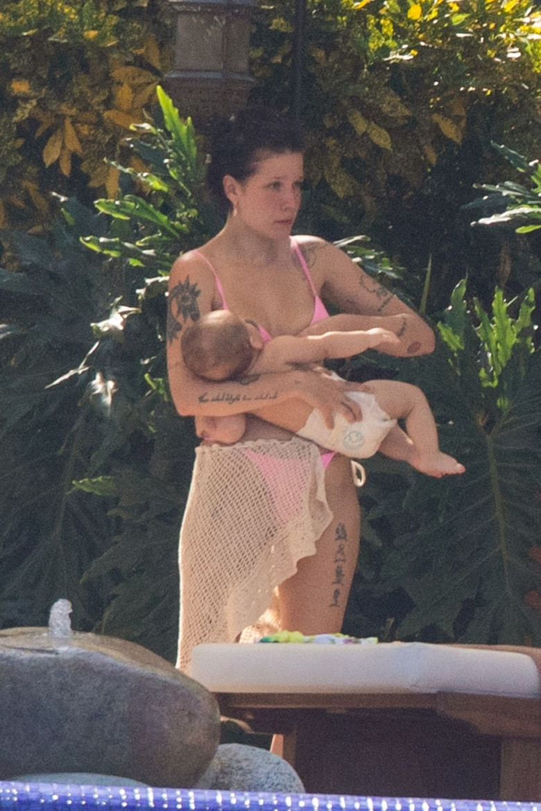 *EXCLUSIVE* Halsey cradles her baby in a bikini while vacationing in Vallarta with boyfriend Alev Aydin and family