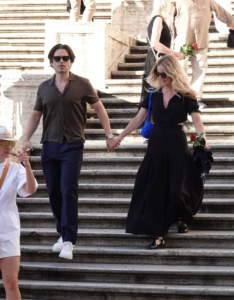 *PREMIUM-EXCLUSIVE* *MUST CALL FOR PRICING* The American Actor Sebastian Stan recreates his own 'Pam and Tommy' out with his blonde beauty Annabelle Wallis spotted out on their romantic holiday in Rome.
