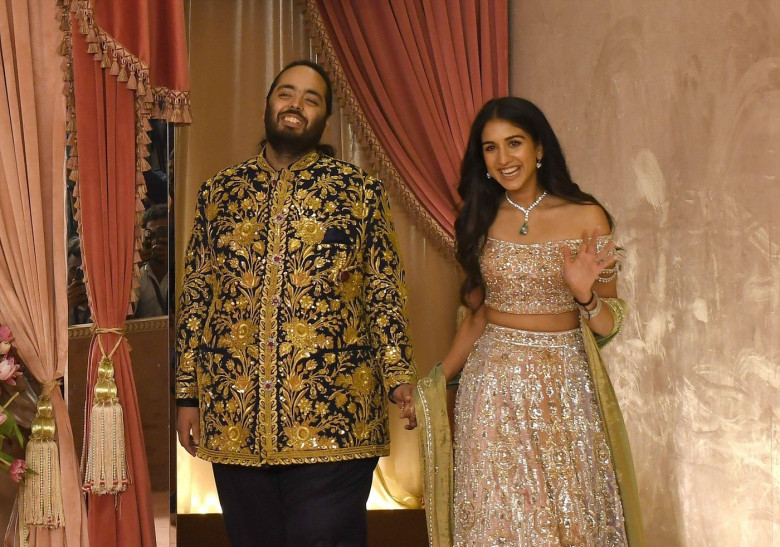 Mumbai, India. 05th July, 2024. Anant Ambani (son of Indian businessman Mukesh Ambani) and his fiance Radhika Merchant seen on the red carpet during the sangeet ceremony at Jio World Centre in Mumbai. Credit: SOPA Images Limited/Alamy Live News