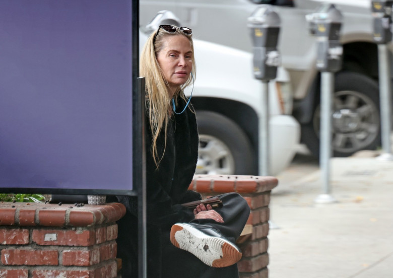 *PREMIUM-EXCLUSIVE* Christina Fulton continues her recovery after son Weston Cage allegedly attacked her at her home ealier in the month, as a detective vehicle is seen leaving her apartment