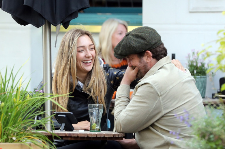 *PREMIUM-EXCLUSIVE* MUST CALL FOR PRICING BEFORE USAGE  - WEB EMBARGO UNTIL 13.45PM UK TIME (8.45 am ET/5.45 am PST) ON 4th JULY 2024 - Scottish actor Gerard Butler, 54, spotted cosying up to stunning Sports Illustrated model, 29-year-old Penny Lane in L