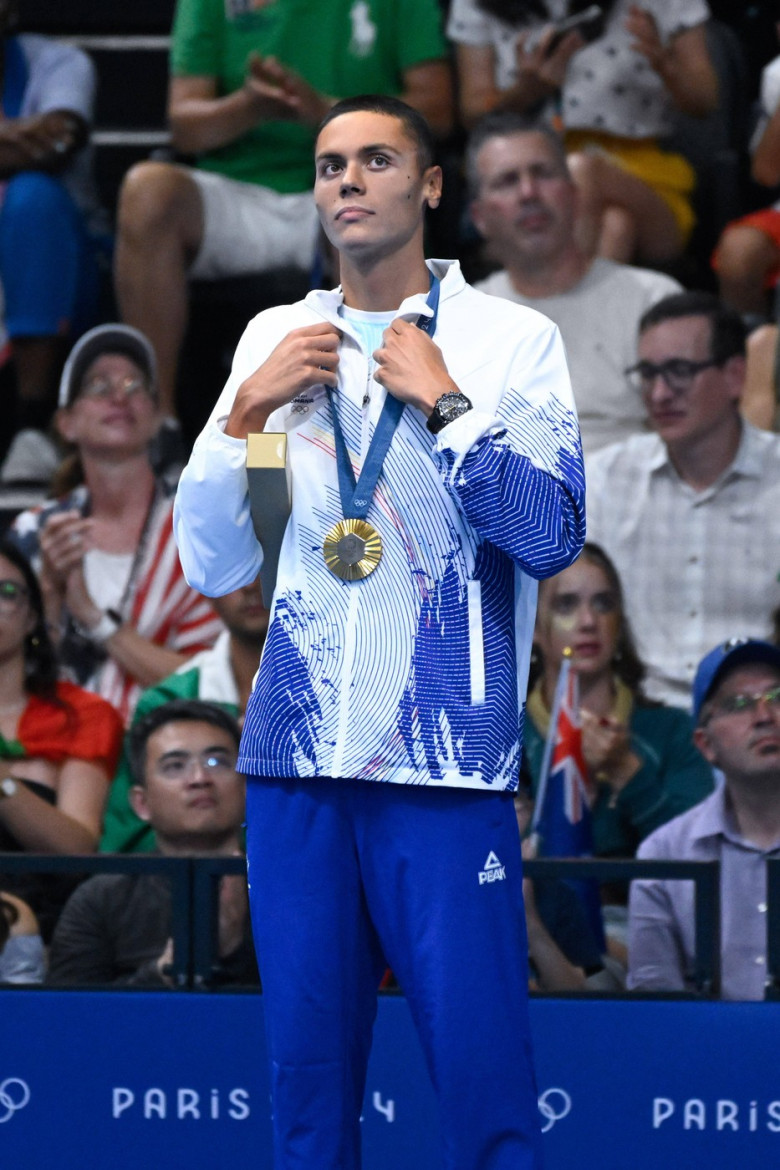 Popovici David ( ROU ) celebrates with his medal during the 2024 Olympics Games Swimming at Paris La Defense Arena on Ju